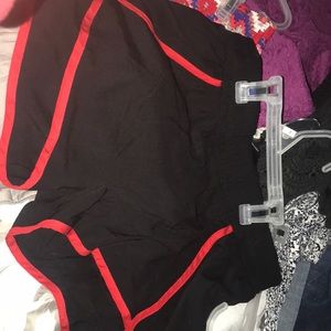 Black boutique shorts with red trim